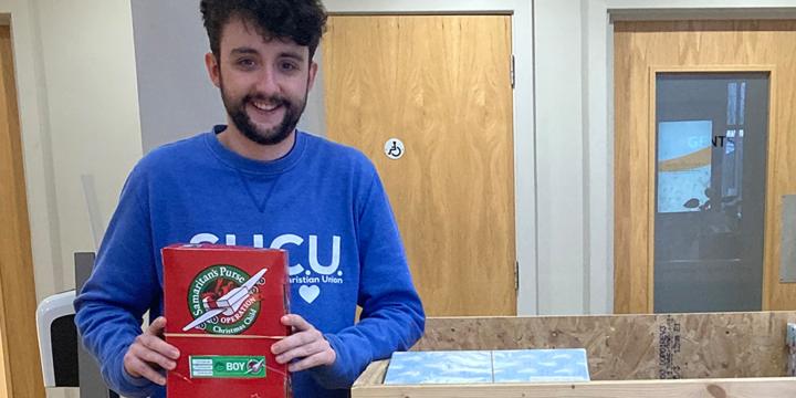 Student dropping off shoebox