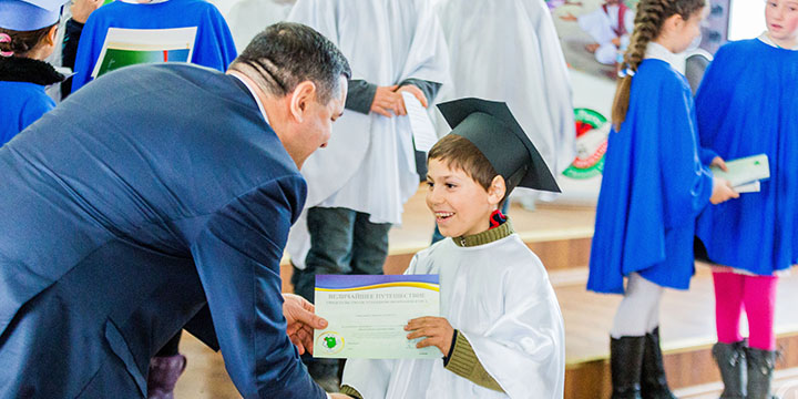 Child in Moldova graduating from The Greatest Journey 
