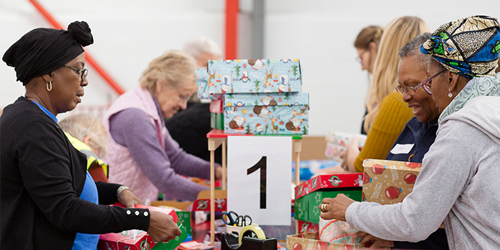 Group of volunteers checking shoeboxes