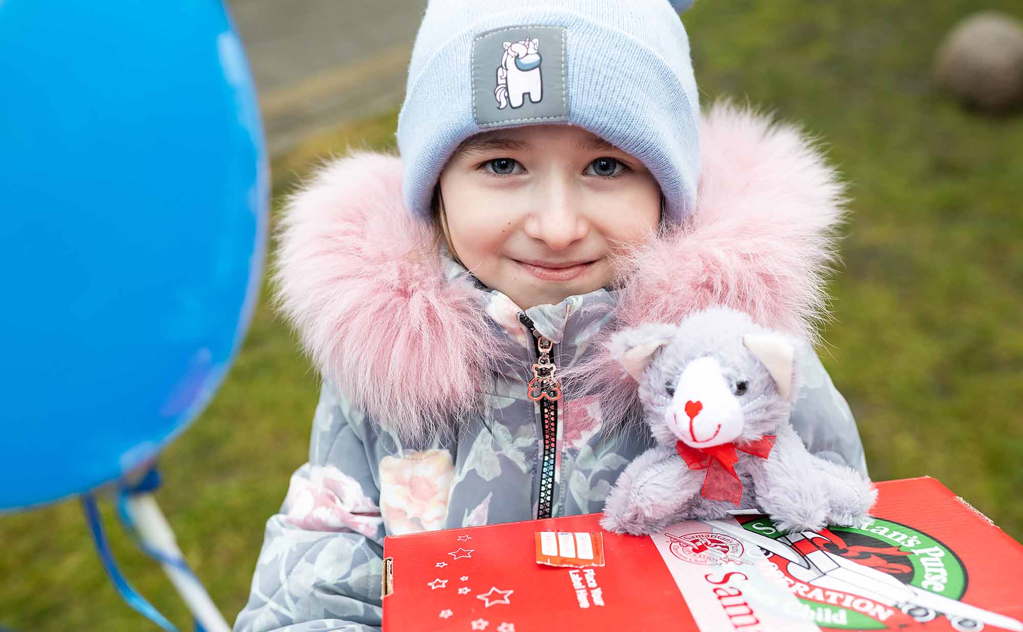 girl holding shoebox