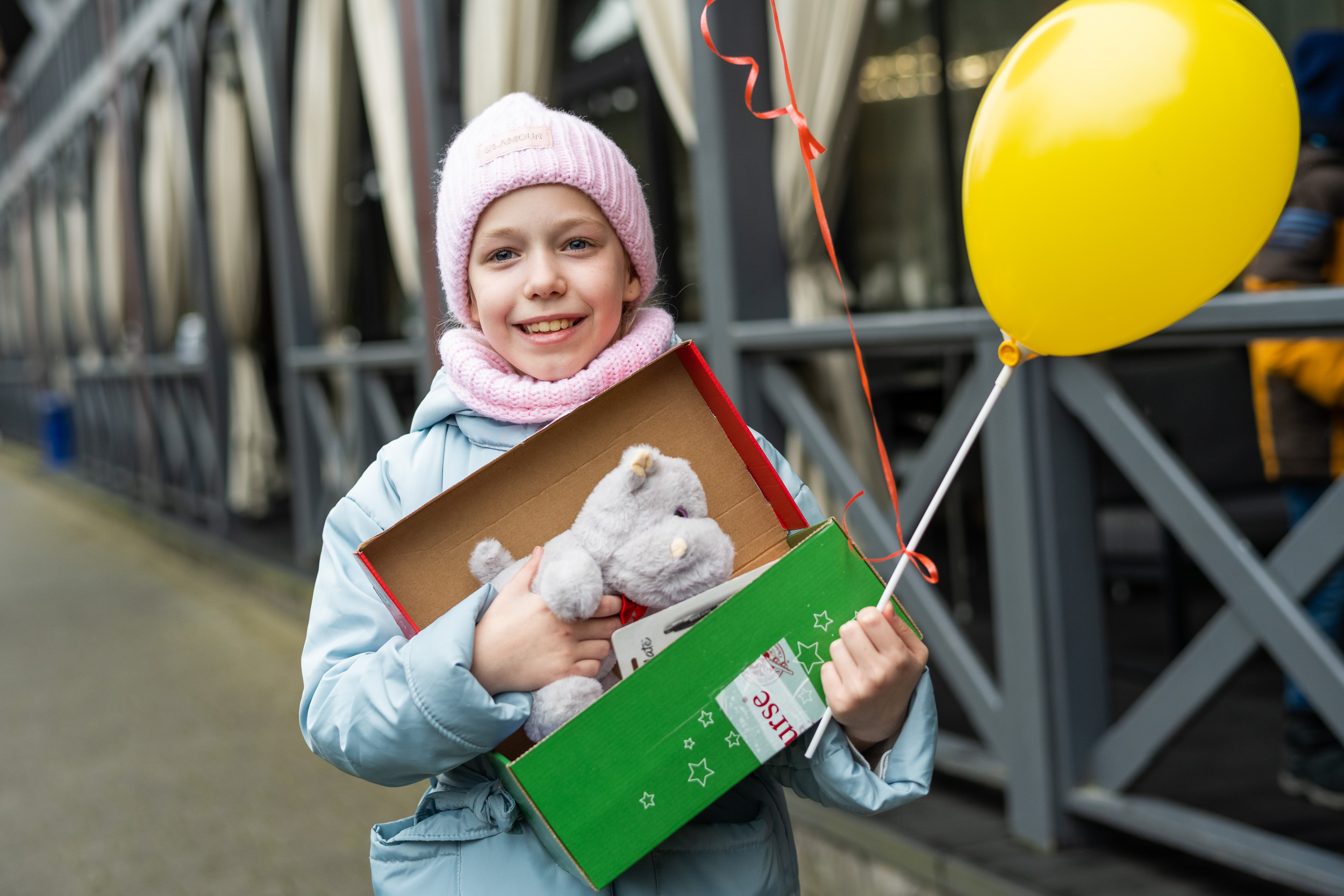 girl holding shoebox