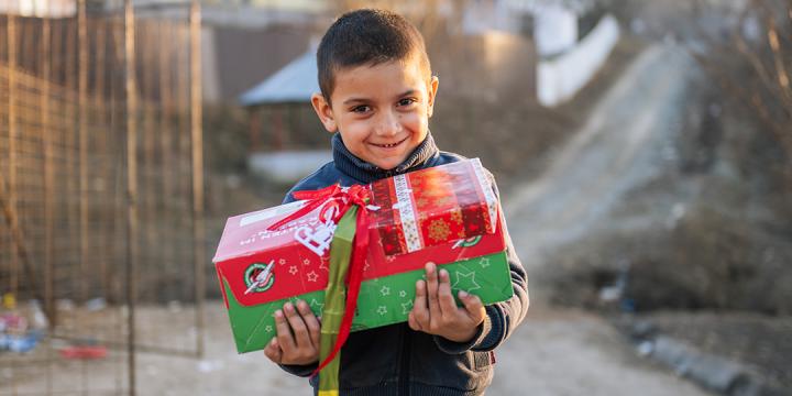 boy holding shoebox gift