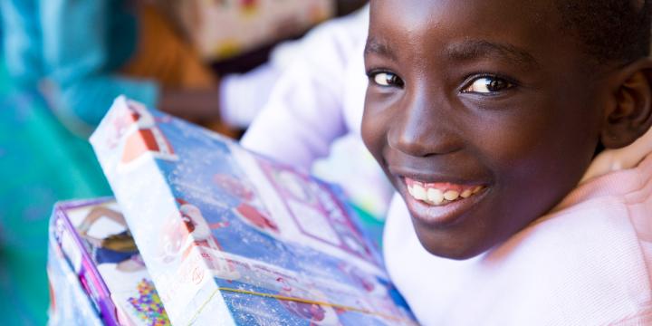 Child with shoebox gift