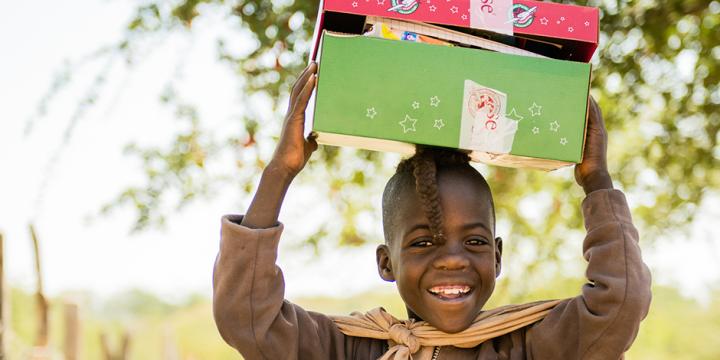 Child in Namibia holding shoebox