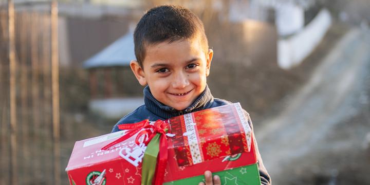 Boy holding shoebox gift