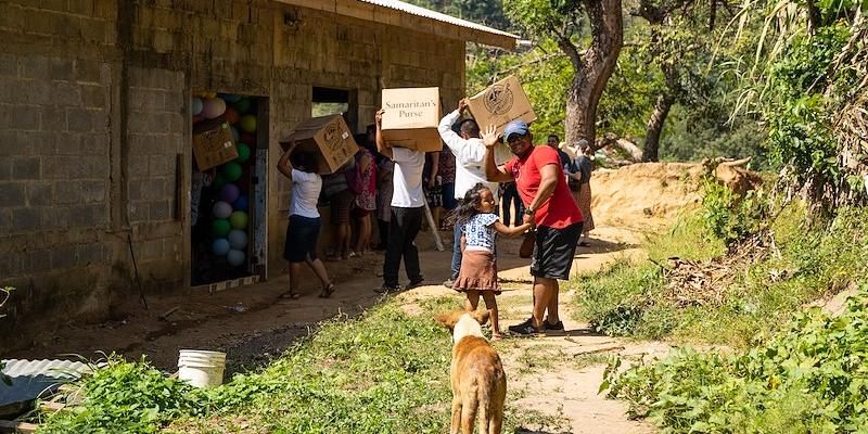 A local dog forms part of the welcoming committee ahead of the shoebox distribution