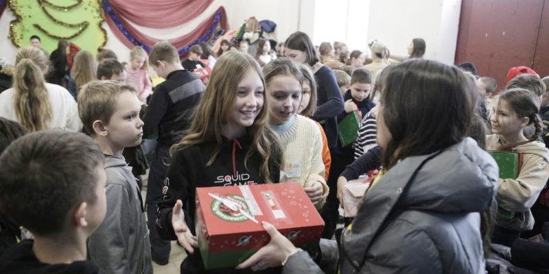 Teenage girl receiving shoebox gift
