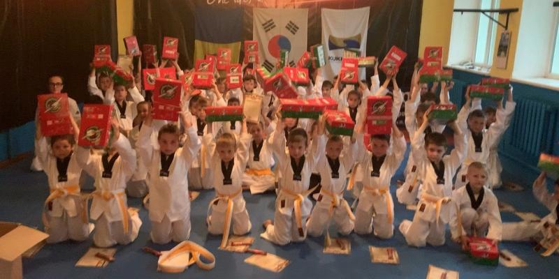 Taekwondo group receiving shoebox gift