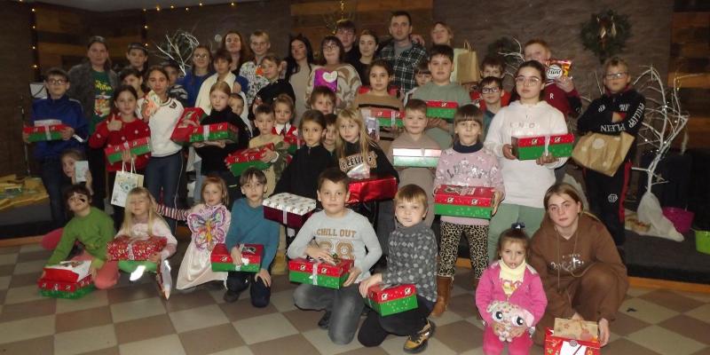 Group of children with shoebox gifts