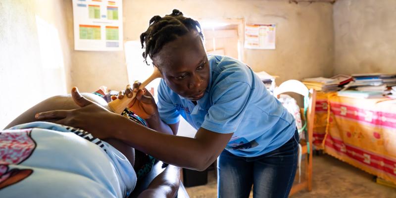 A NURSE USES A LISTENING TOOL TO MONITOR A BABY’S HEALTH AT A LOCAL CLINIC RECENTLY RENOVATED BY SAMARITAN’S PURSE WITH A MATERNITY WARD.