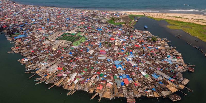 An aerial view of West Point, home to nearly 100,000 people in Monrovia. Densely packed homes stretch to the sea, where sanitation and health services are critically limited.