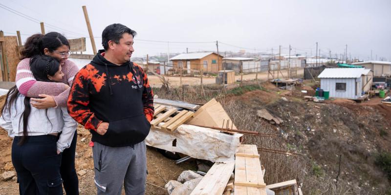 Fernanda and her parents survey the damage in the area.