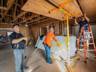TEAM WORKING TO REBUILD THE KOYUK CHURCH