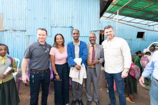 Edward Graham, far right, visited with ministry partners while at the Operation Christmas Child outreach event.