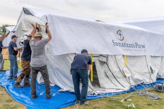 Disaster Assistance Response Team members work to set up part of the Emergency Field Hospital.