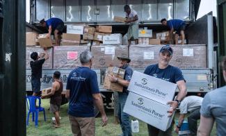 The Samaritan's Purse team unloads components of the Emergency Field Hospital in Naypyidaw.