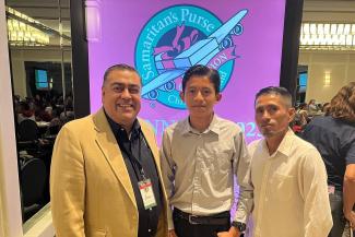 Bolivar Santos (right) and Maykel (center) celebrate God’s faithfulness in their journey together with Ivan Solorzano, Operation Christmas Child’s regional manager for Latin America North.
