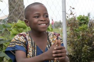 Fidèle learning to smile, laugh, and learn at our child-friendly safe space in Congo.