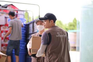 Samaritan’s Purse staff unloads relief kits to distribute to hurting families in Vietnam.