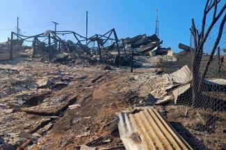Once Fernanda’s family home, charred remains like these covered the neighbourhood after the fire.