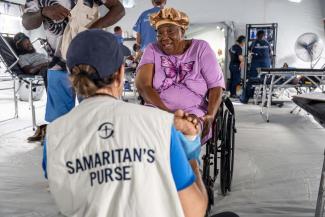Jennifer smiles as she thanks a Samaritan’s Purse nurse who cared for her injured foot at the Emergency Field Hospital.