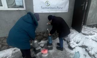 Villagers in eastern Ukraine congregate at a local church to collect fresh water, which has been in short supply since early in the conflict.