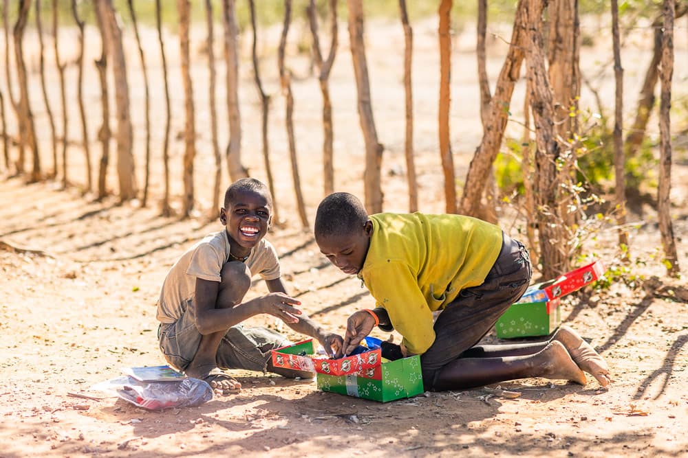 Boys playing with their gifts